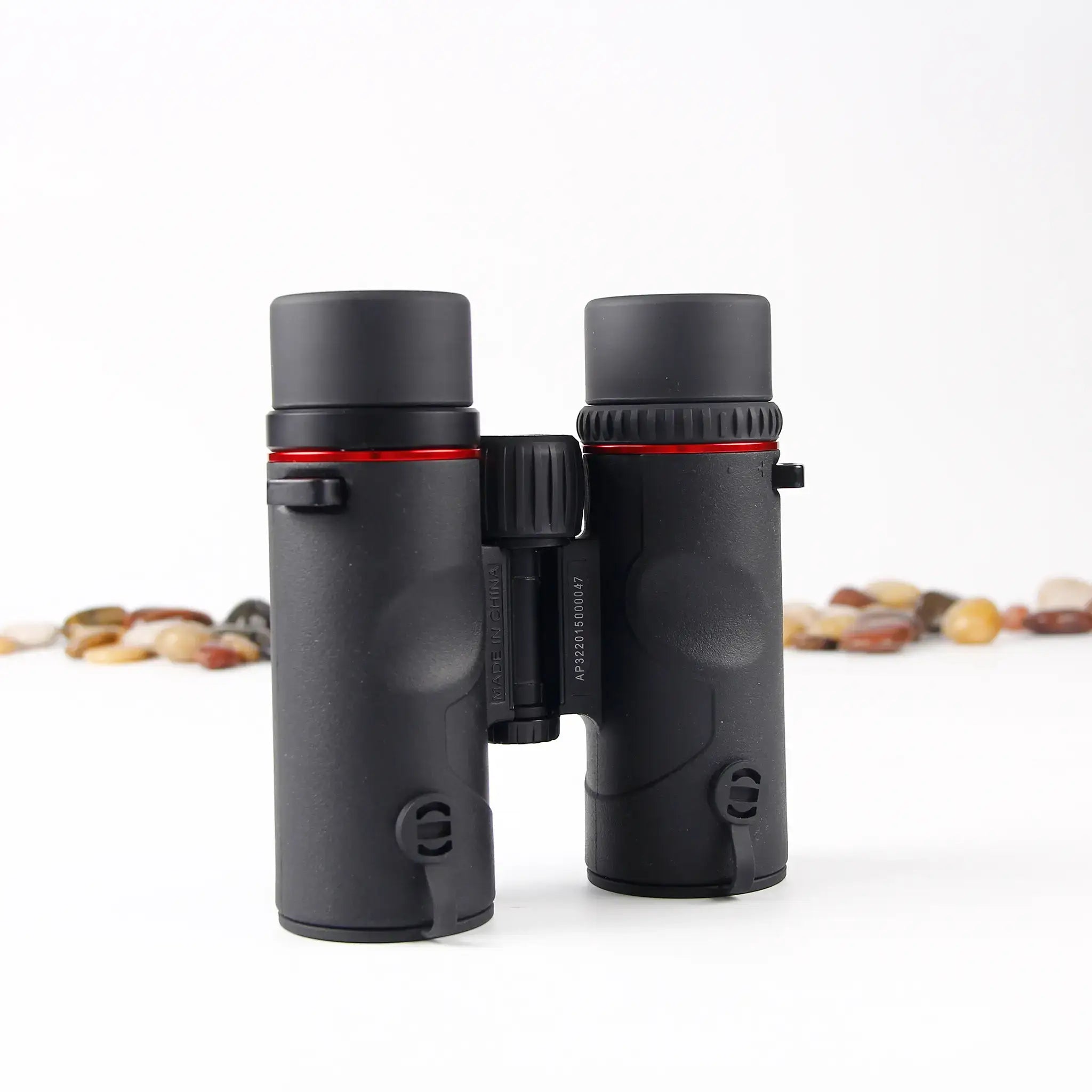 bottom view of APRESYS H0832 8x32 ED binoculars showing magnesium alloy body construction and durable optical build quality