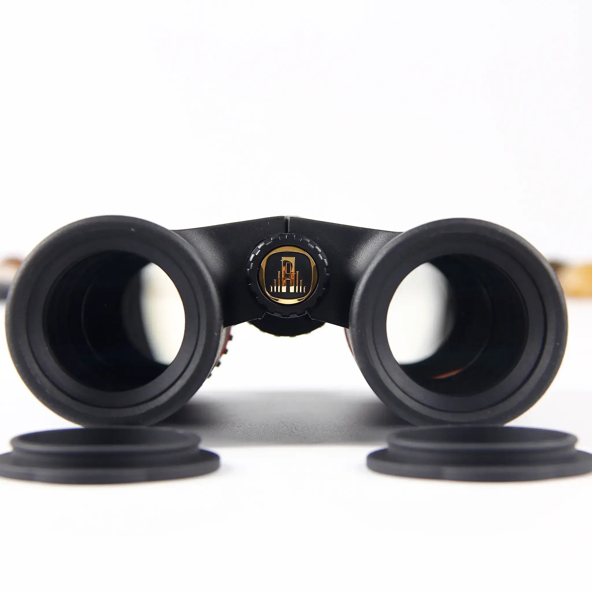 close-up of APRESYS H0832 ED binoculars objective lens with FMC multi-coated optics for high light transmission and image clarity